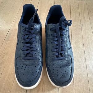 Pair of Nike Air Force 1s size US 11.5, navy & white. Lightly worn condition.